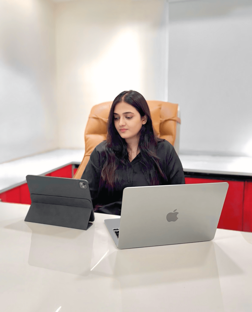 Anupama Gupta, Founder of YMM digital siting in the office.